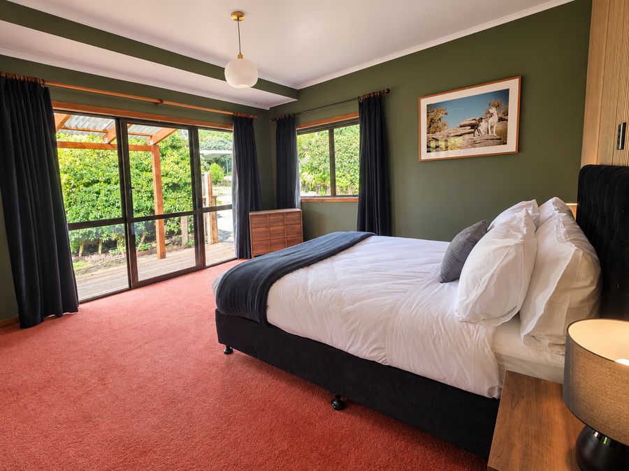 Master bedroom with sliding doors out to the covered deck